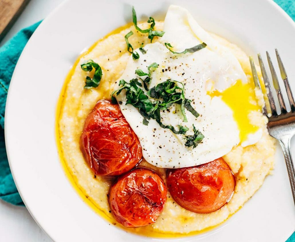 Gluten free creamy polenta with roasted tomatoes and poached eggs